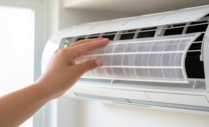 Maintenance concept with air filter being held for cleaning.