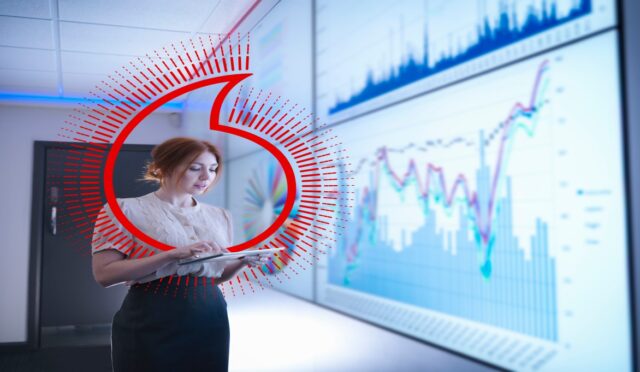 Businesswoman studying graphs on screen with digital tablet